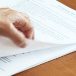 parent turning pages of an IEP
