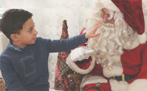 Young boy visiting with Sensitive Santa