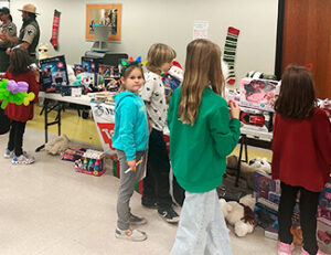 Kids at Inclusive Santa event looking at toys