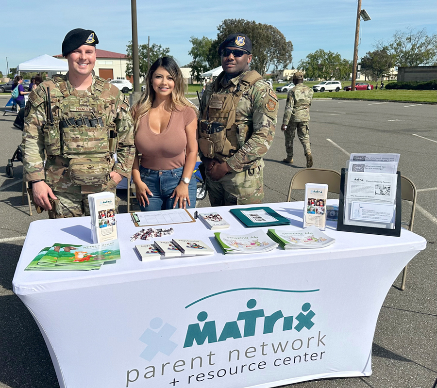 Julie Feliz at our  Matrix Parent Network booth with Travis AFB Security officers